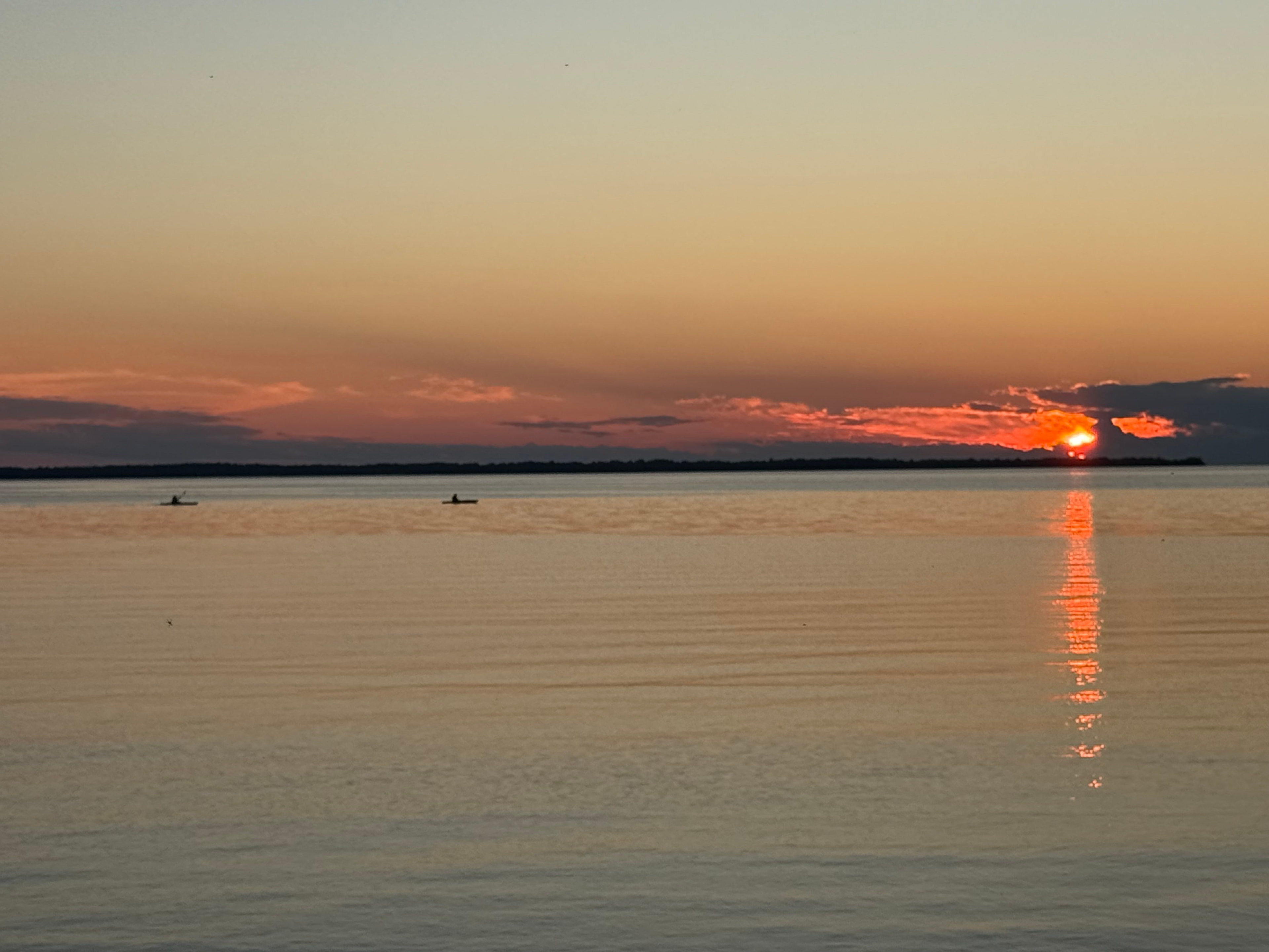 Kayakers on the Wide Open Lake at Sunset
