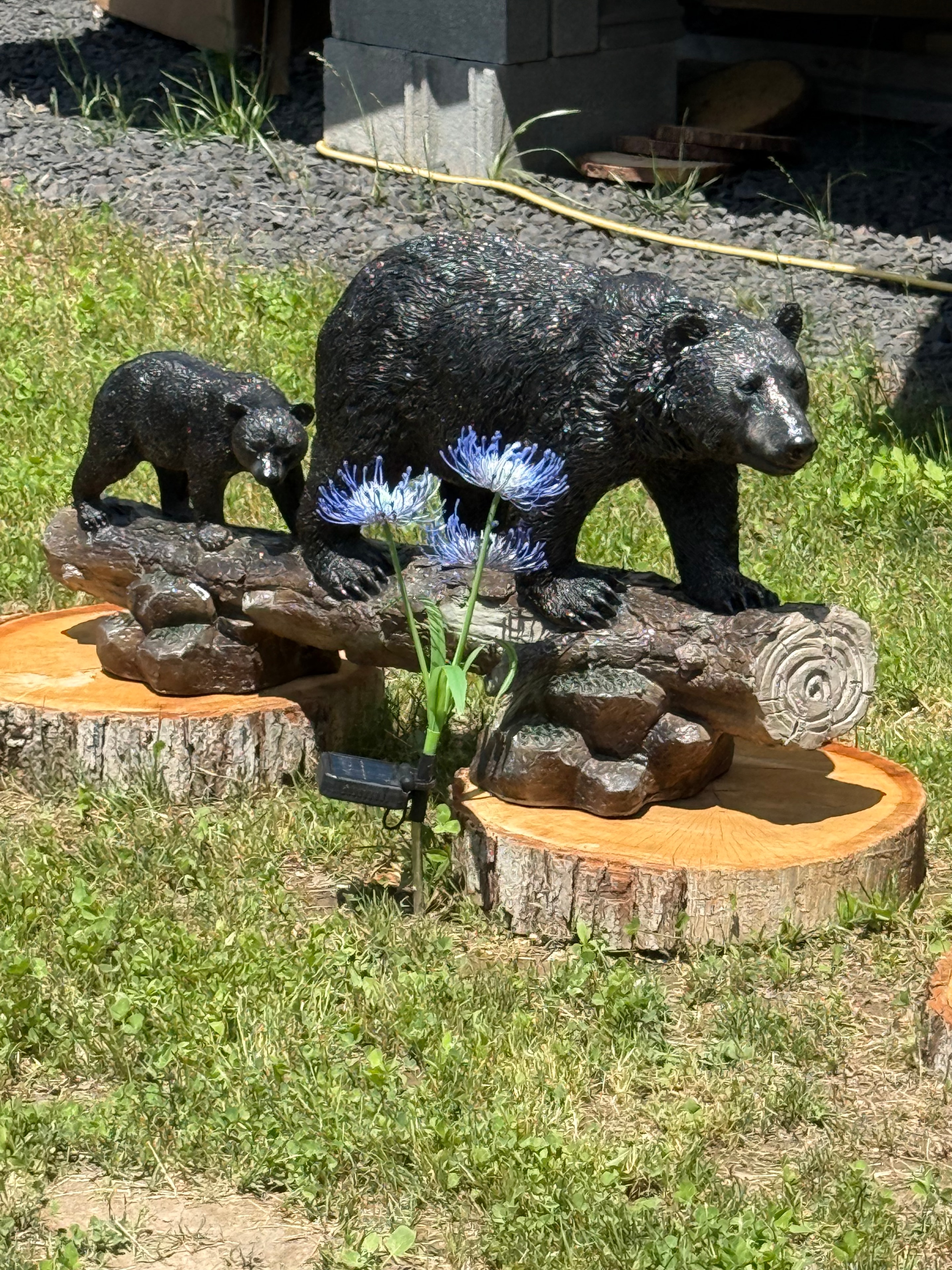 Bear sculpture on a log