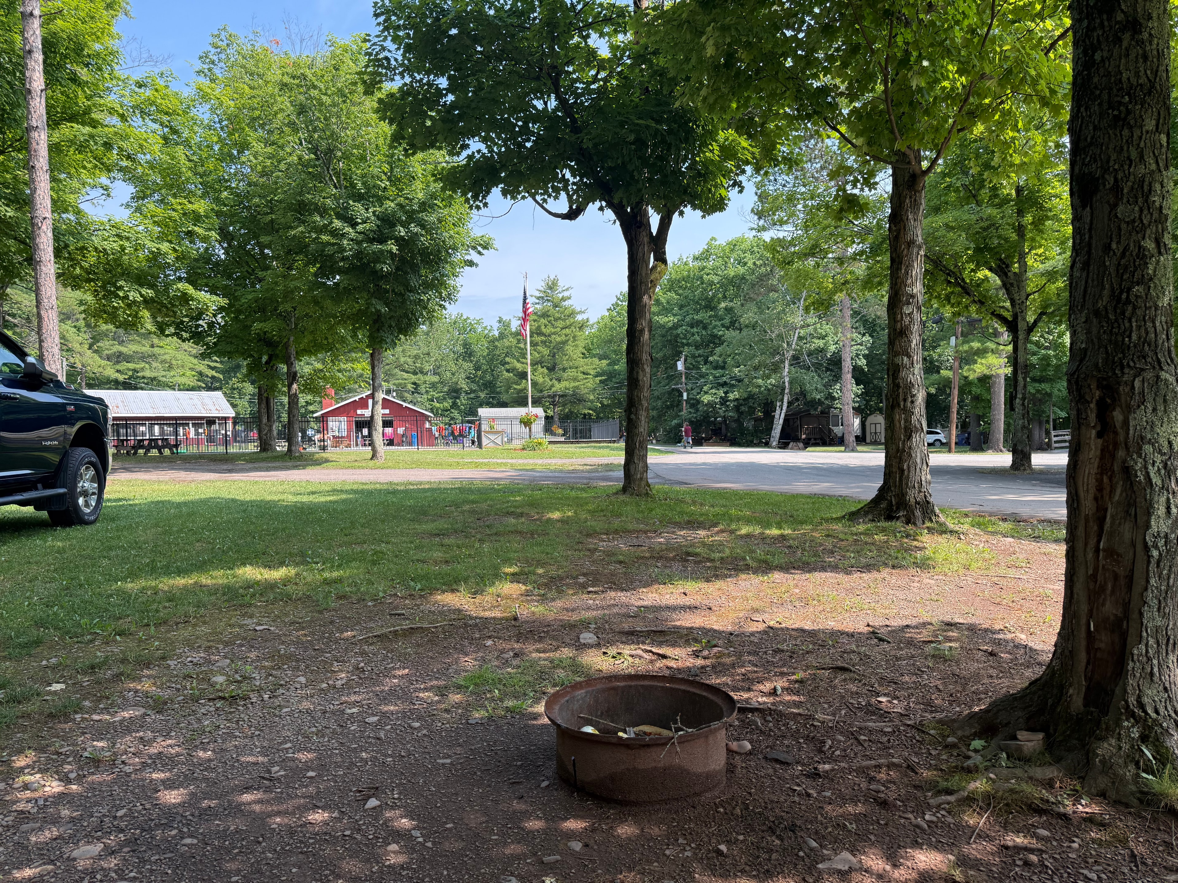 After the heavy rain last night, camp is quiet — fire ring and open field