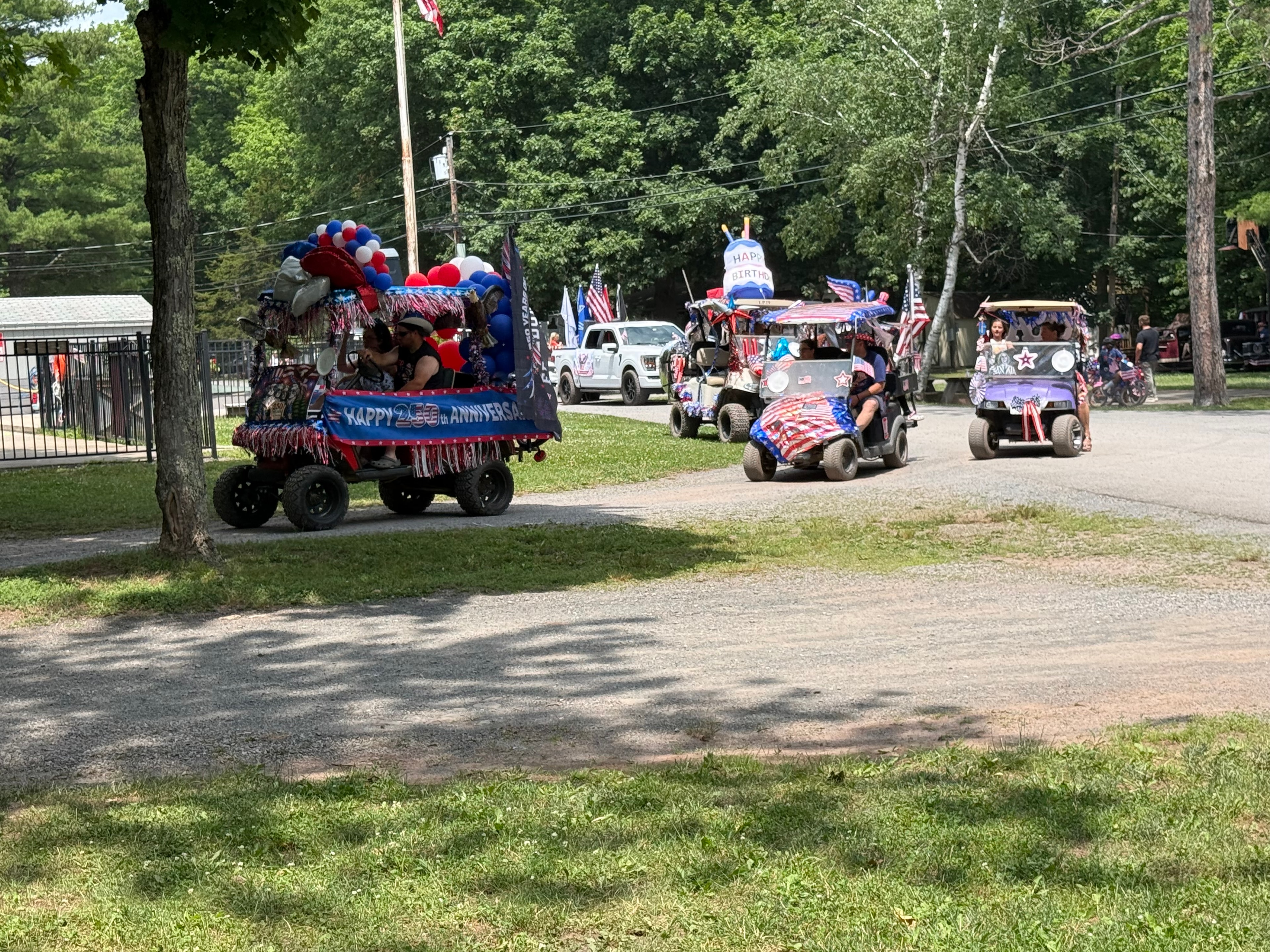 Happy 250th Anniversary cart — wide shot with full parade behind