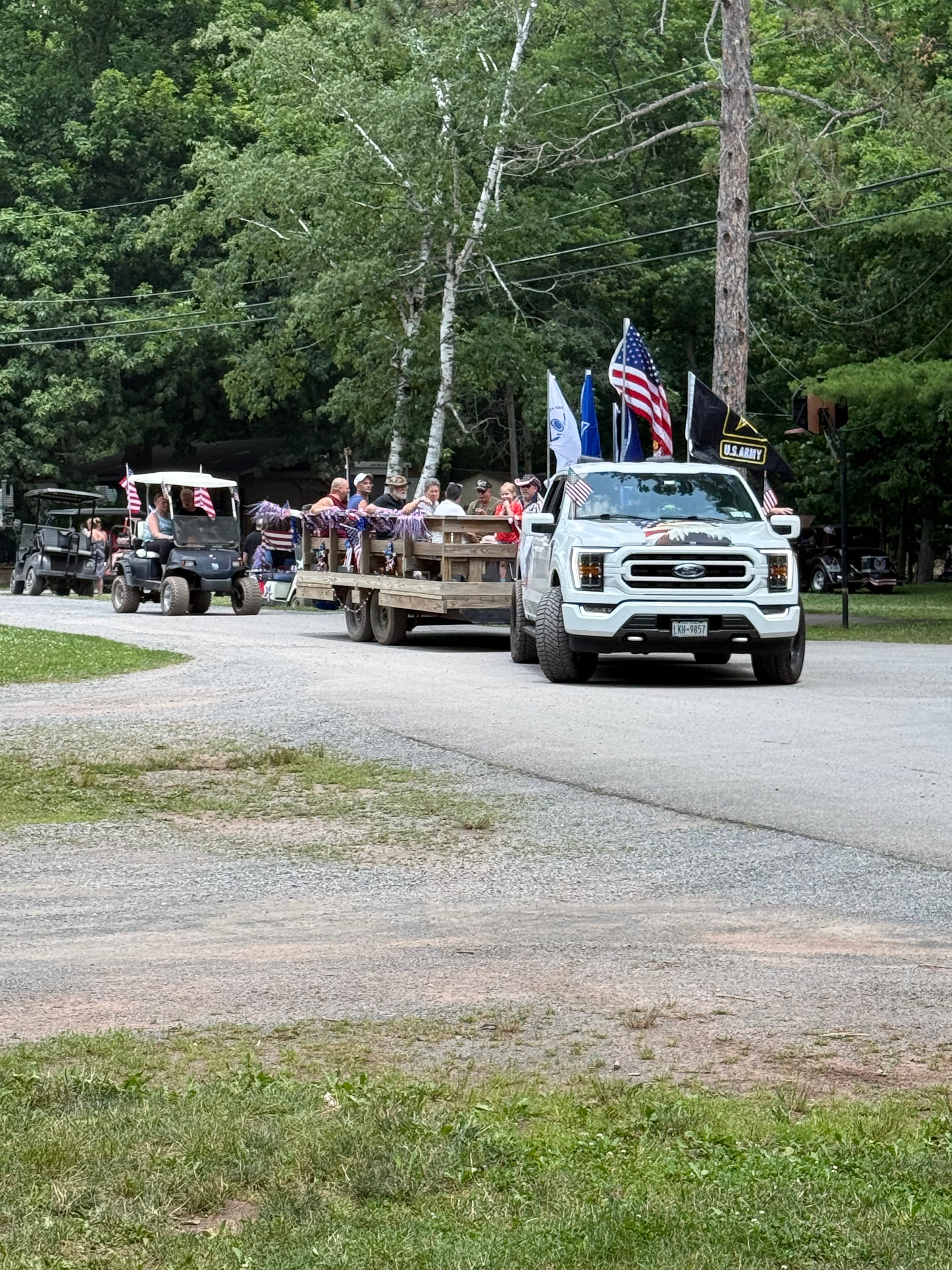 Army truck with flags leading the parade