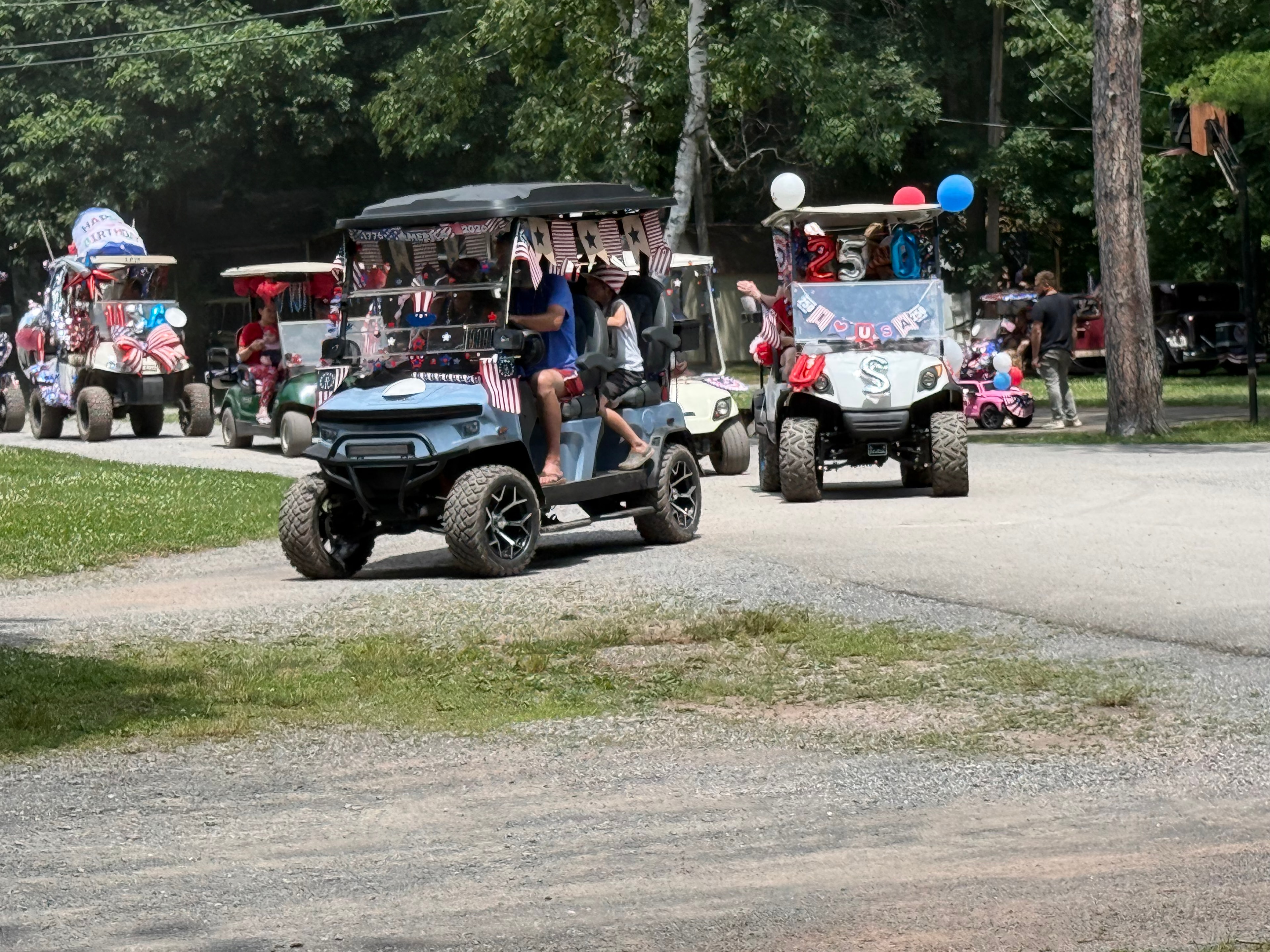 Blue cart with 250 & USA balloons in the parade
