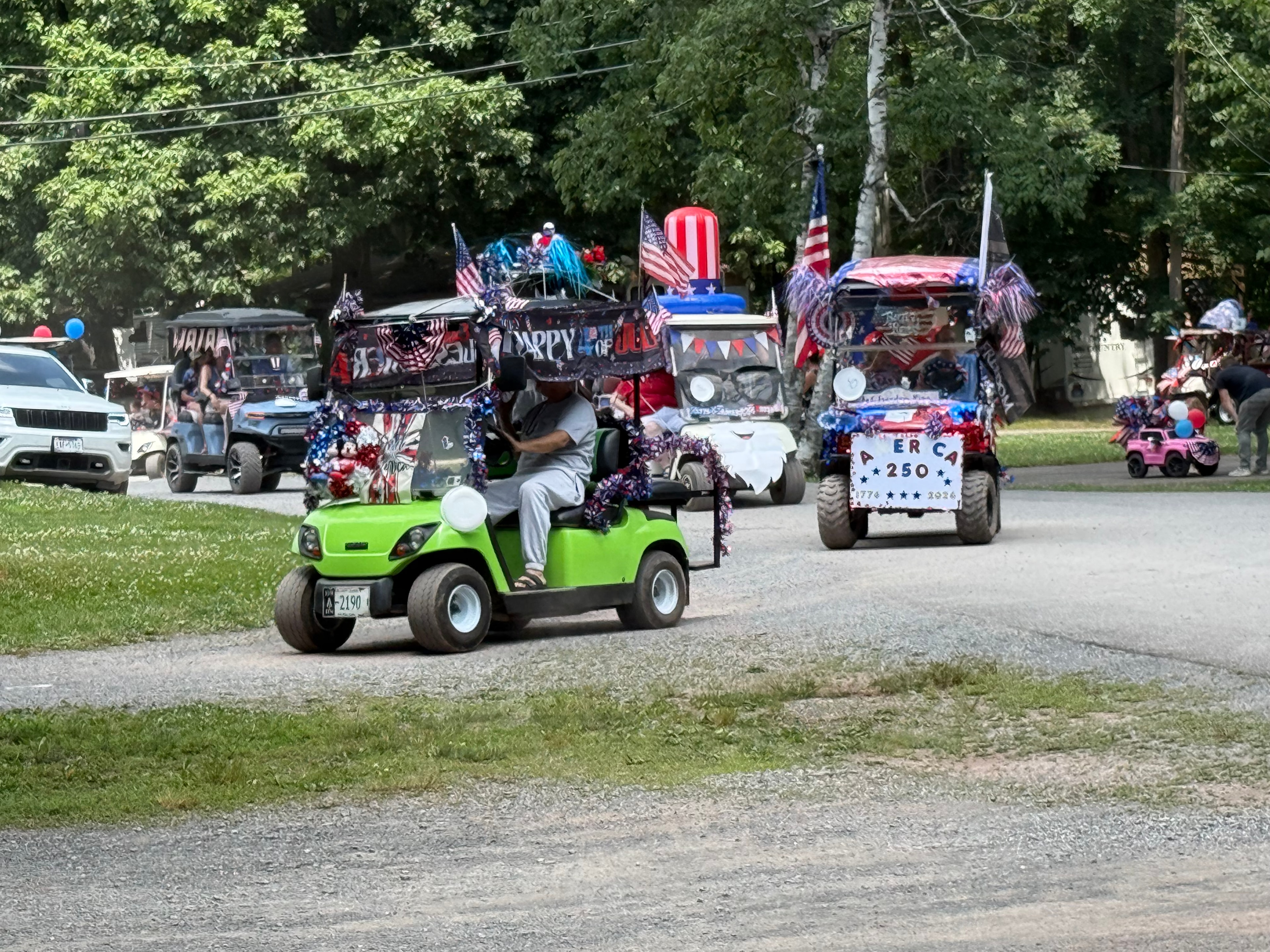Lime green cart with America 250 sign — 1776 to 2026