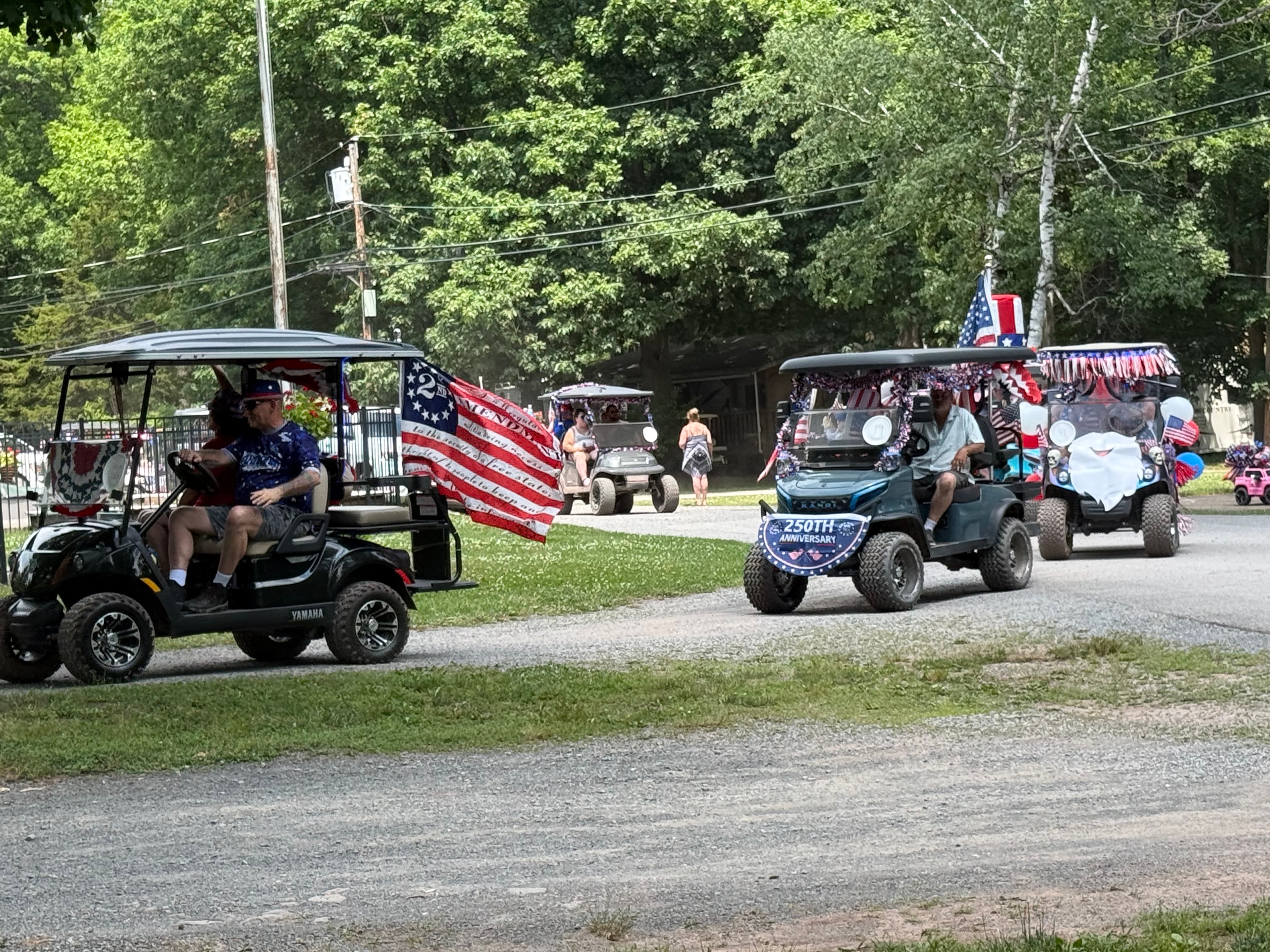 Yamaha cart with 250th Anniversary banner in the parade