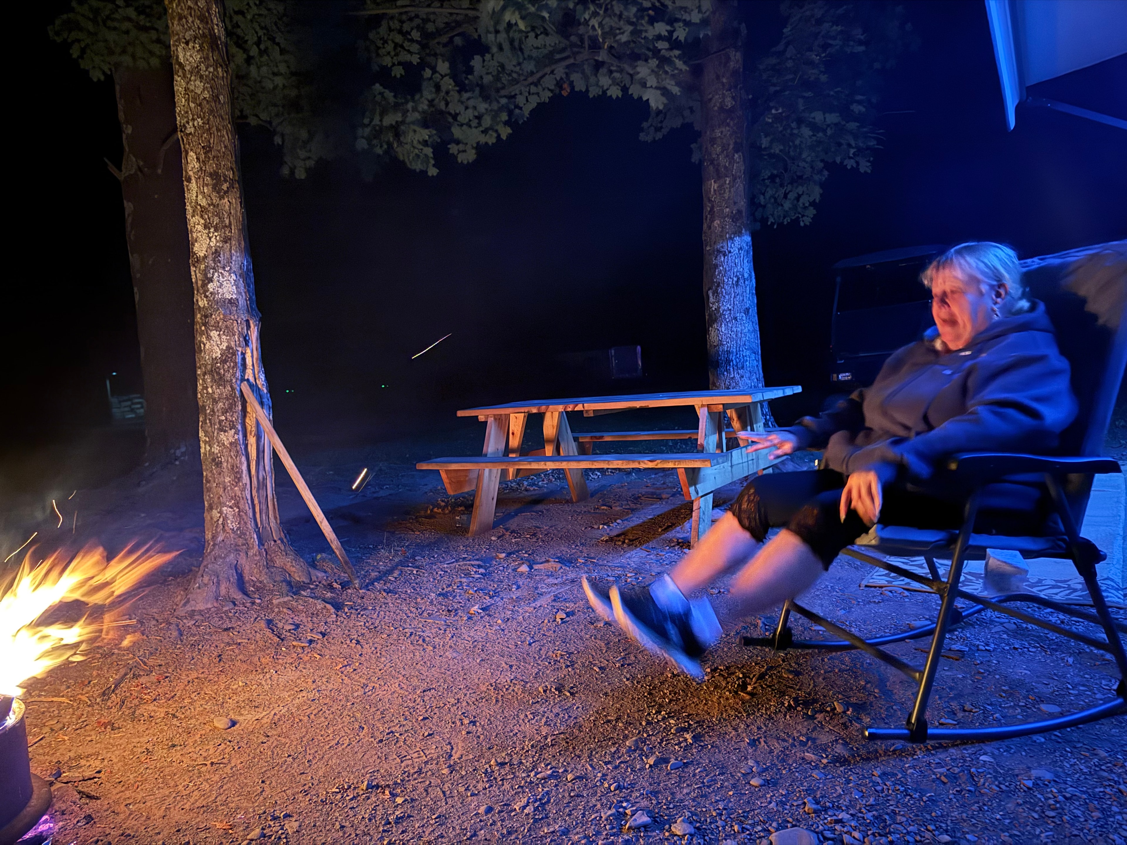 Relaxing by the campfire at night