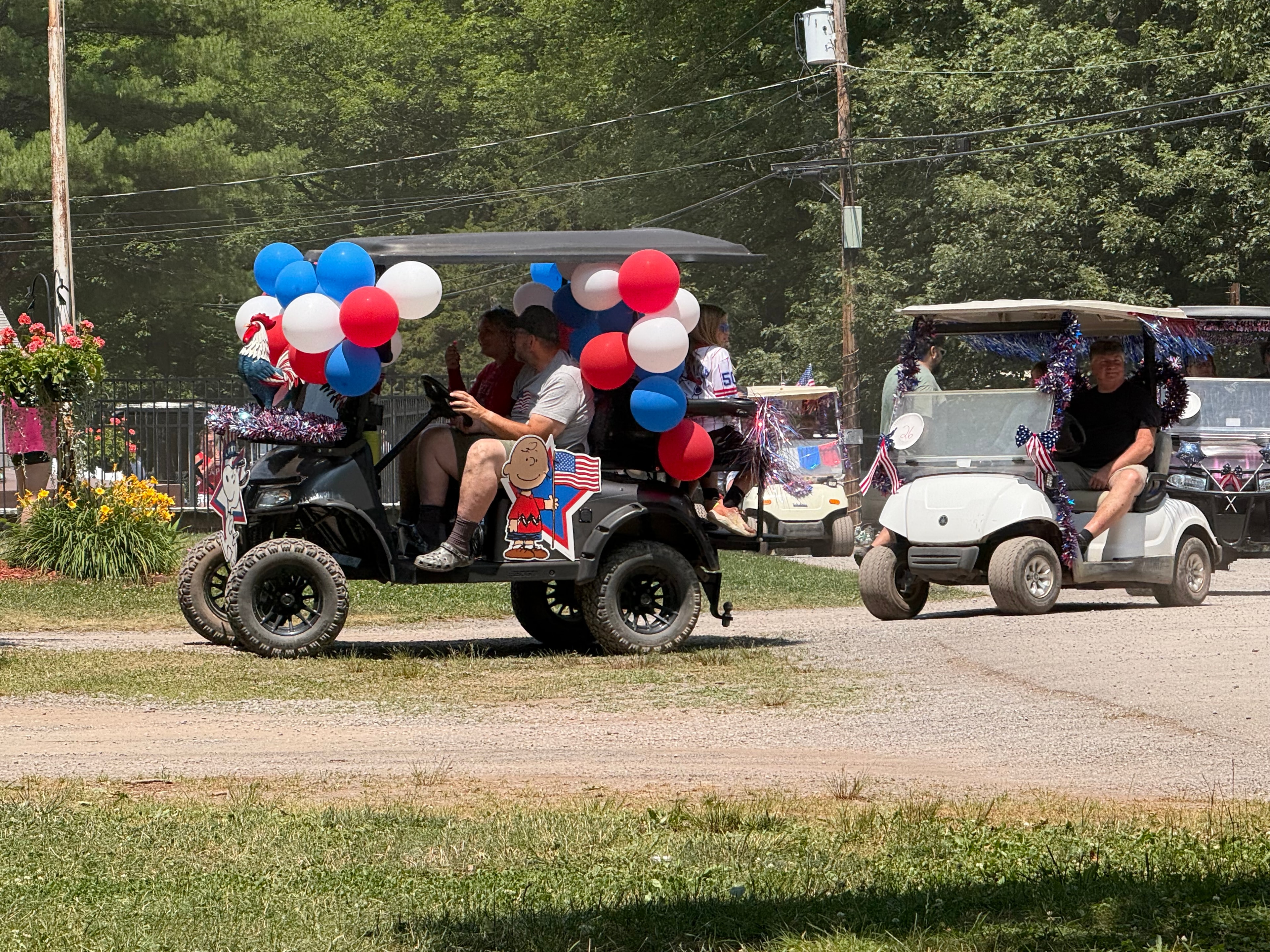 Charlie Brown cart with red white and blue balloons
