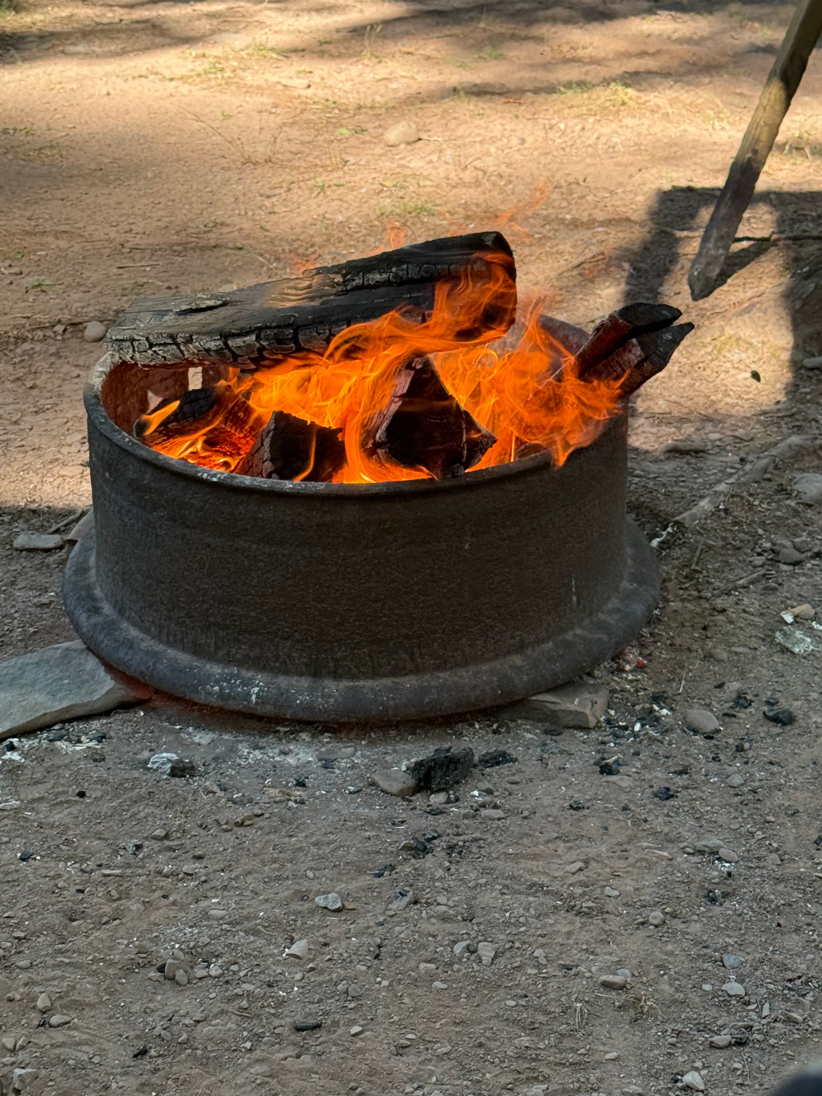 Fire pit blazing at the campsite