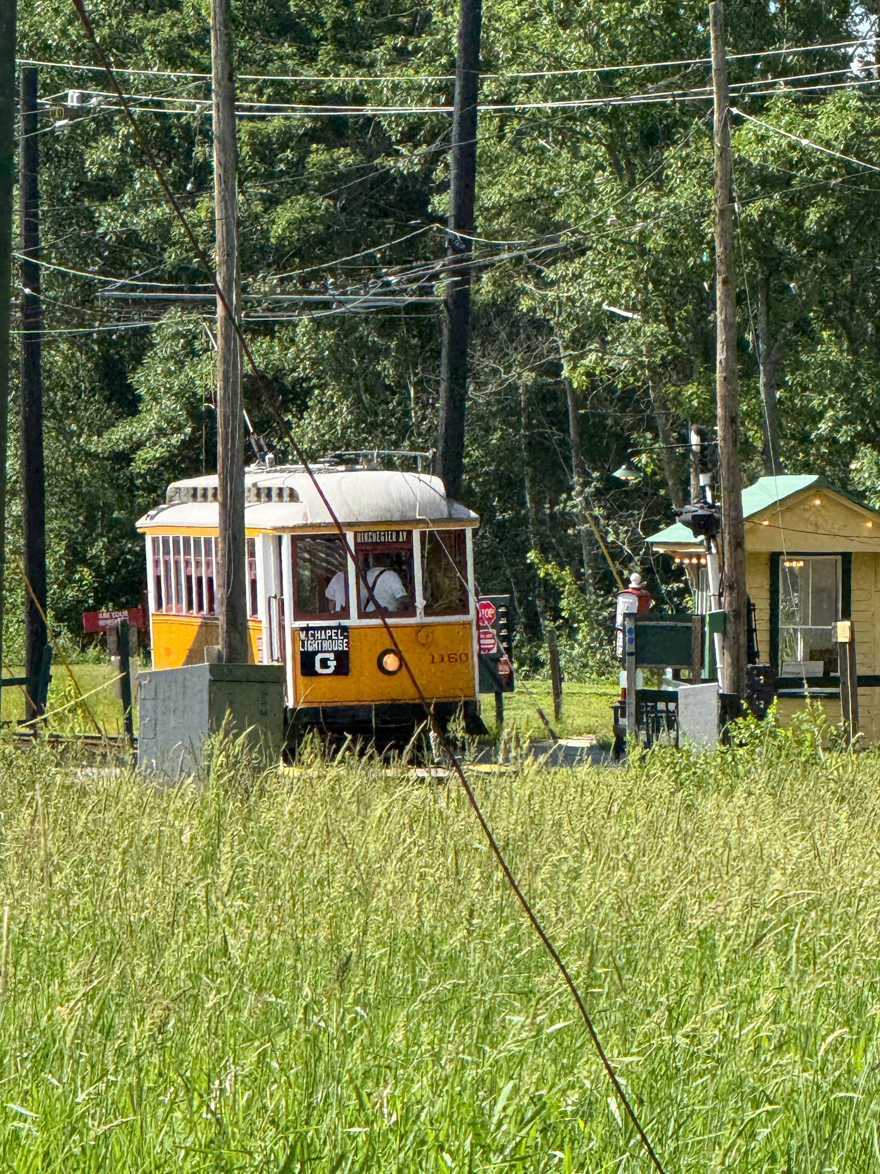 Yellow trolley car on the tracks
