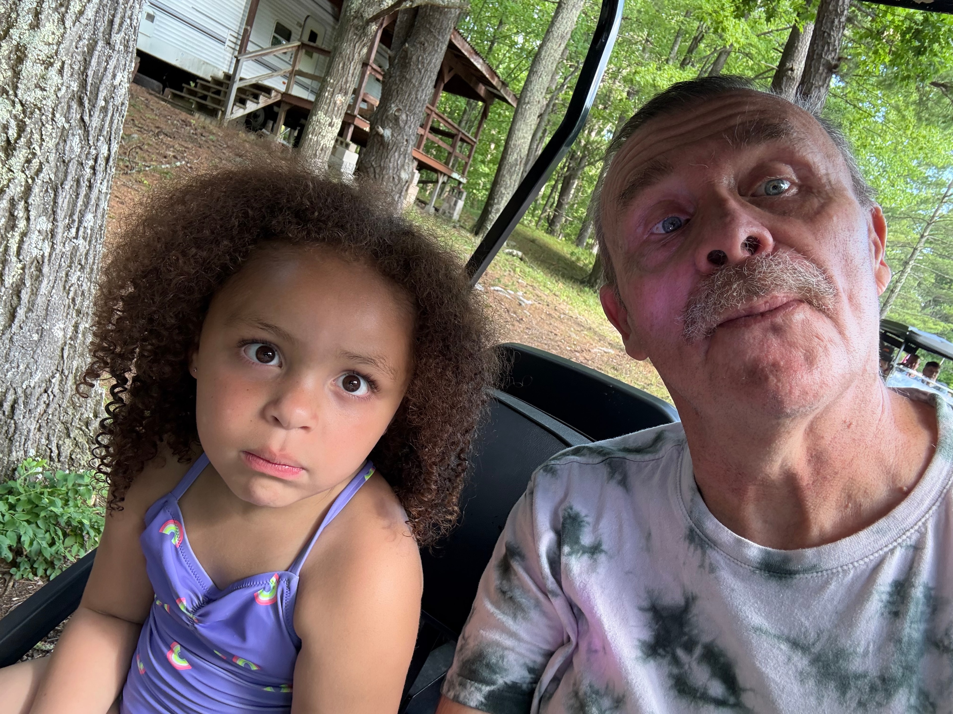 Golf cart ride through the woods with Grandpa
