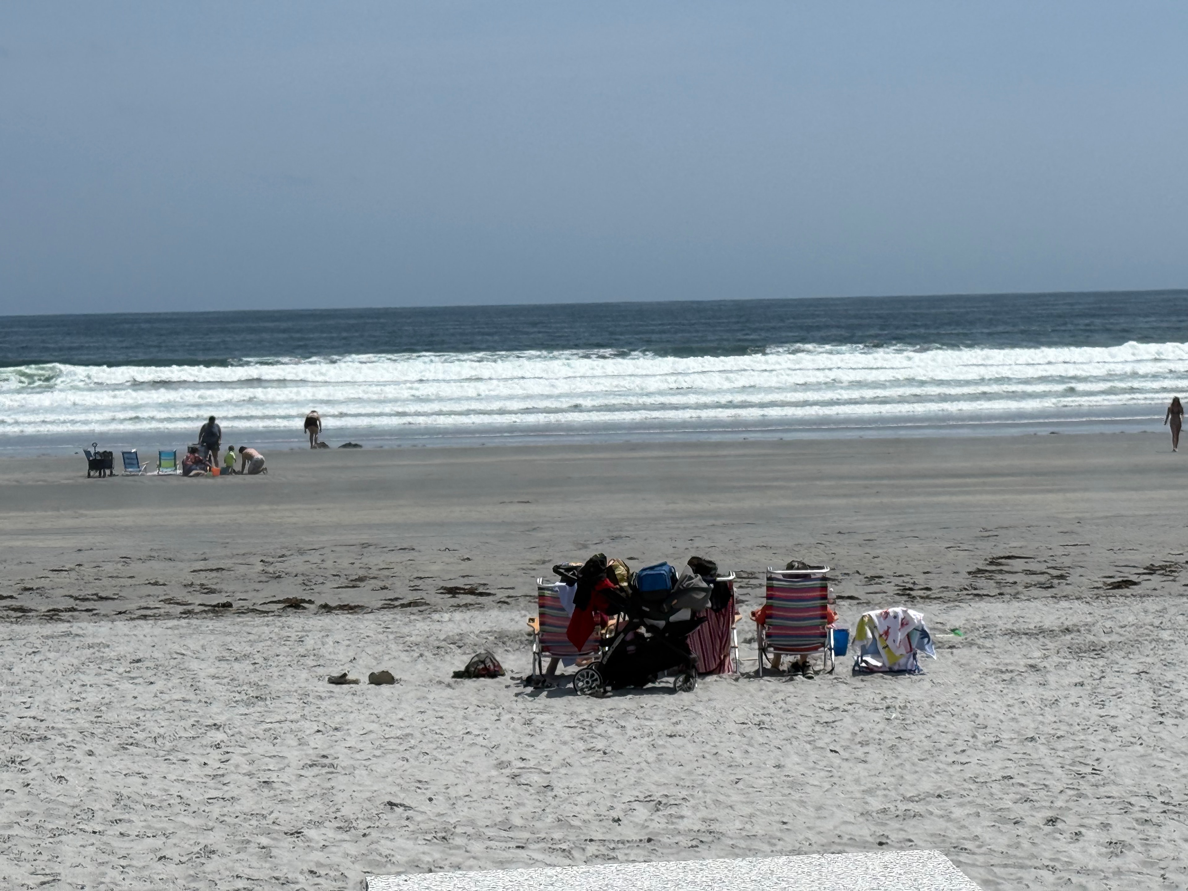 Beach chairs set up with waves rolling in