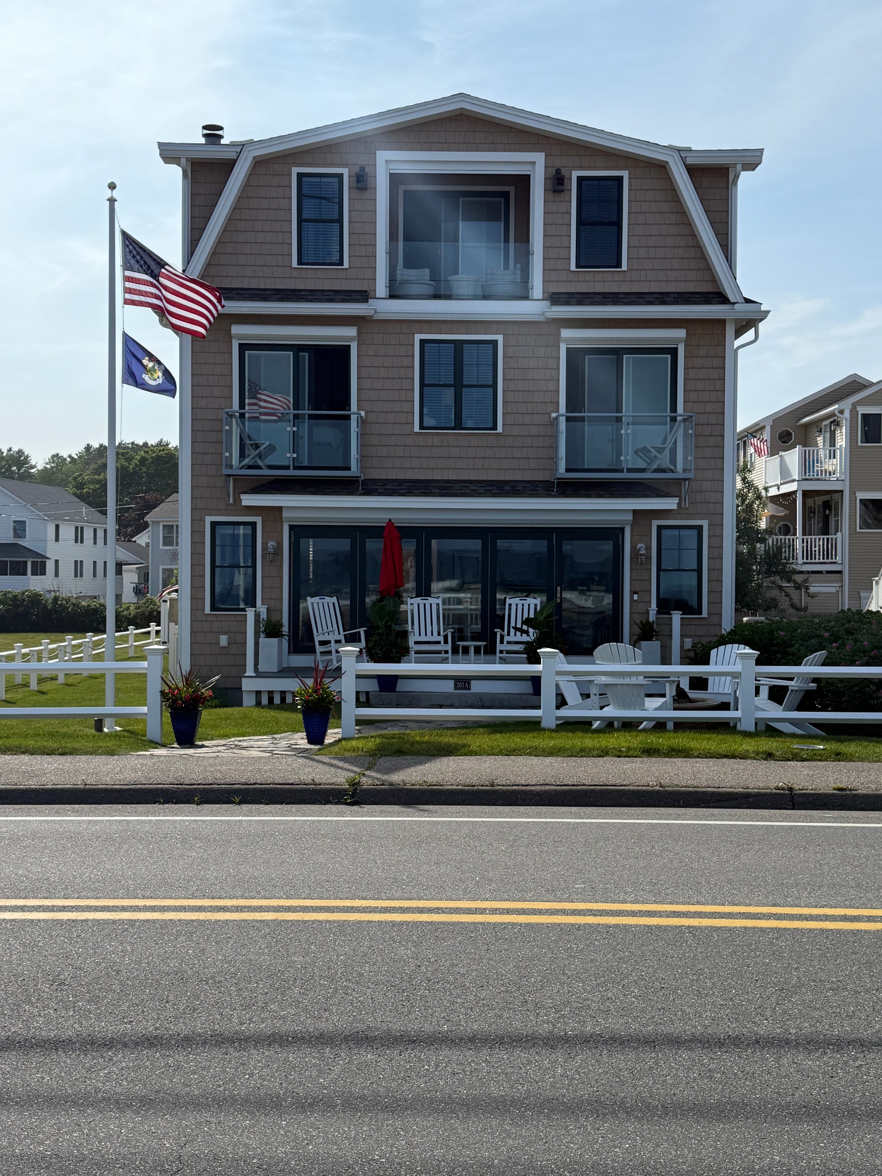 Beach house with American and Maine flags flying
