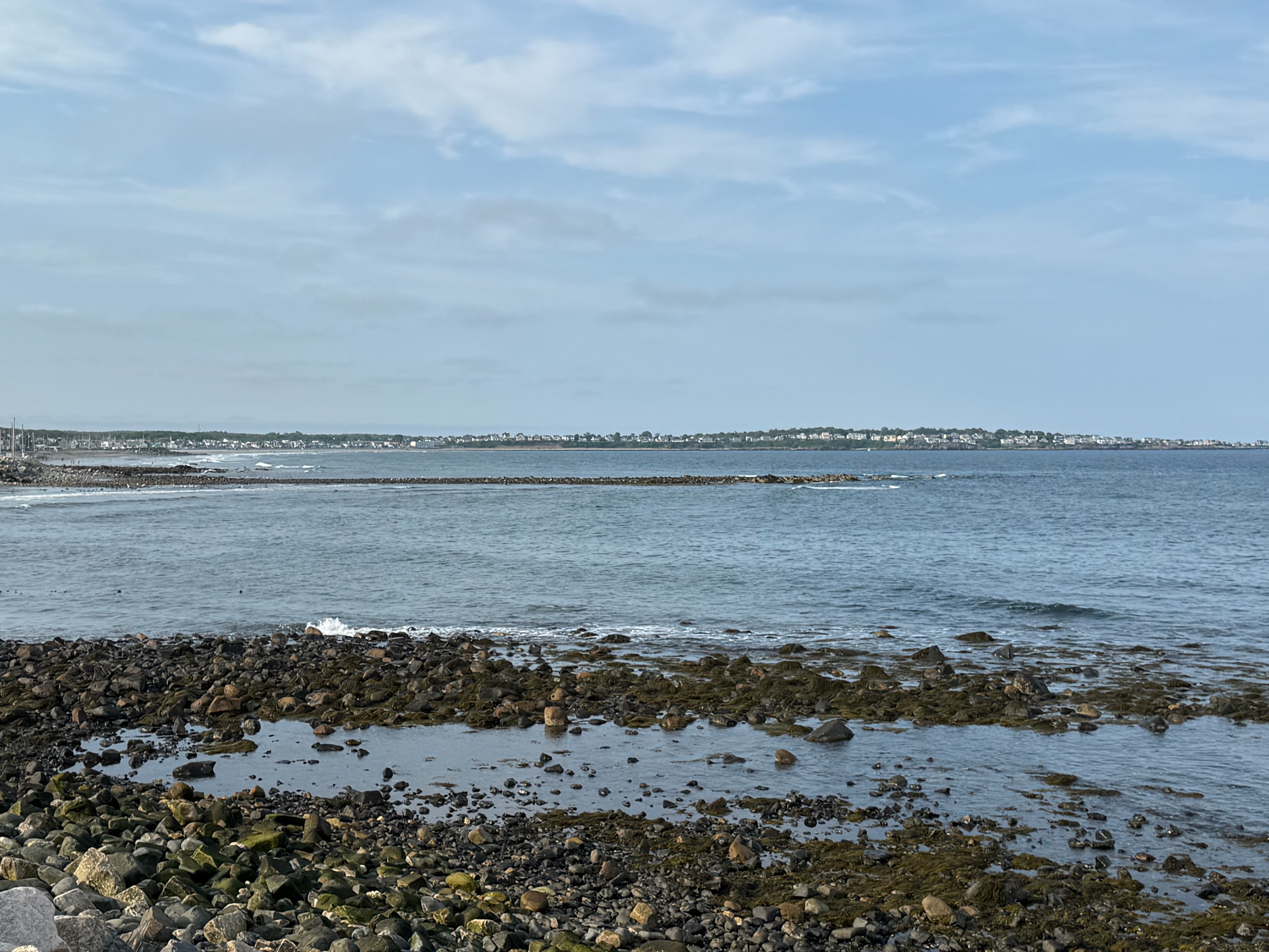 Rocky bay shoreline looking out to sea